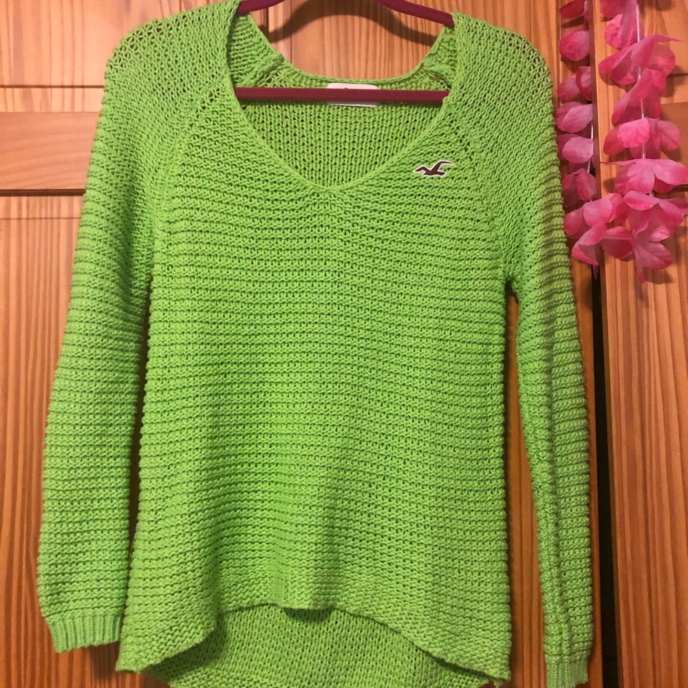 A green Hollister open-stitch sweater.